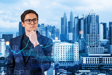 Young eastern handsome businessman pondering about new approaches to consultancy to find priorities...