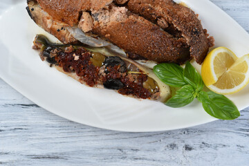 grilled fish with sun-dried tomatoes and olives
