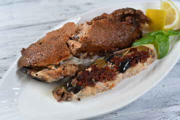 grilled fish with sun-dried tomatoes and olives
