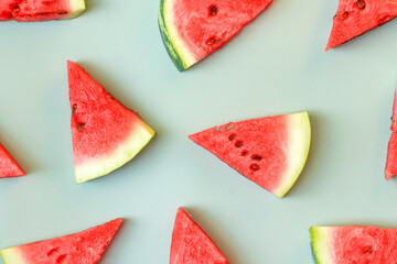 Fresh watermelon slices on green background. Summer fruits pattern.