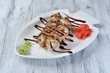 sushi, rolls with salmon, philadelphia cheese, cucumber, tuna shavings, wasabi and ginger
