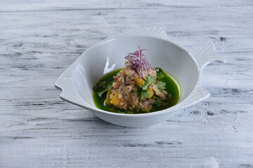 fish tartare with oranges and onions with green sauce