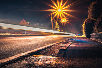 Country Road with light Trails from vehicles.