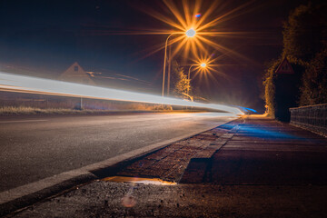 road with light trails from cars