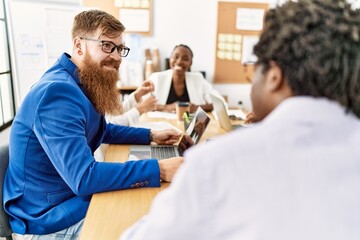 Fototapeta premium Group of business workers smiling happy working at the office.