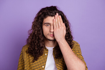 Photo of young man cover eye arm visit oculist check up health care isolated over purple color...