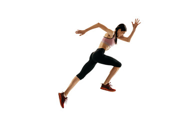 Fototapeta na wymiar Young caucasian woman running isolated on white studio background. One female runner or jogger. Sport, track-and-field athletics, competition concept