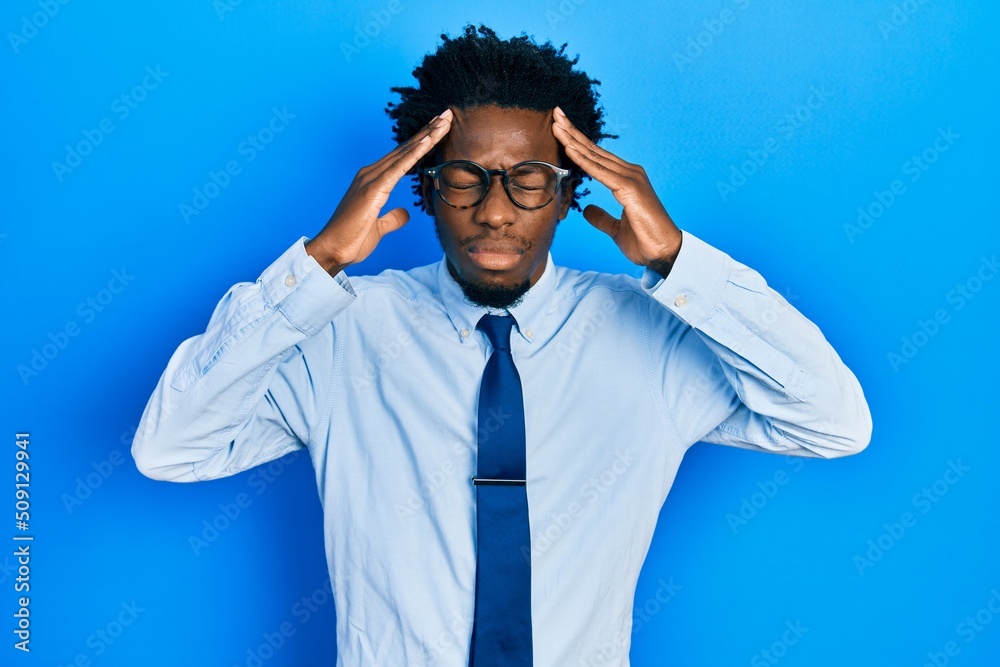 Poster Young african american man wearing business clothes with hand on head, headache because stress. suffering migraine.