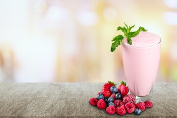 Spring or summer refreshing cold cocktail with berries, lemonade