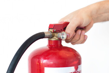 Concept of handling fire extinguishers, the hand squeezes on the fire extinguisher lever, on an white background, close-up