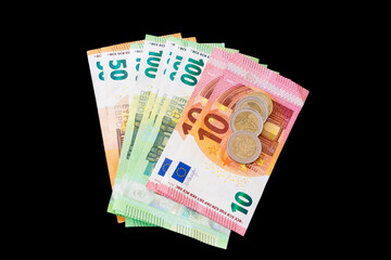 Various euro banknotes on black background
