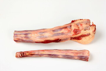 Raw uncooked ox or cow tail on white isolated background