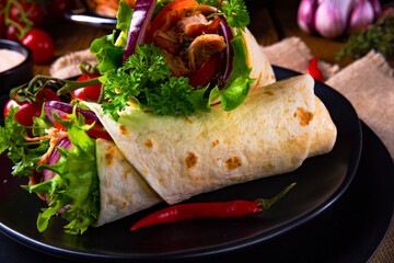 tasty pulled pork wrap with vegetables.