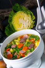 delicious savoy cabbage soup in white vase