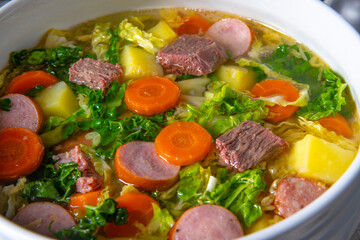 delicious savoy cabbage soup in white vase