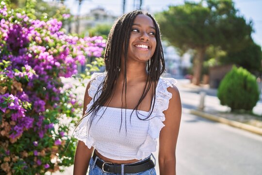 Young african american girl smiling happy standing at the city.