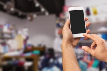 Clothing Store, Female Using Smartphone with blank screen