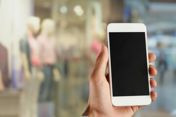 Clothing Store, Female Using Smartphone with blank screen