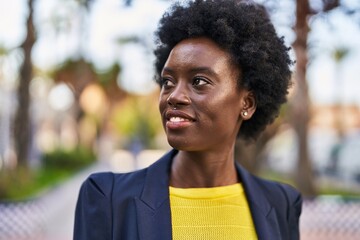 Young african american woman business executive smiling confident at park