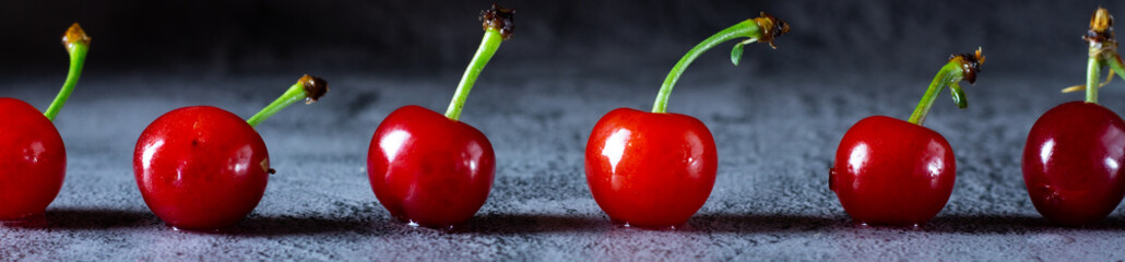 Cherries in a row closeup and blurred background