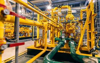 Pressure meters on natural gas yellow pipeline red valves. Concept industry power plant background