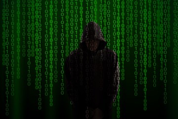 Computer Hacker in Hoodie. Obscured Dark Face. Hacker Attack, Virus Infected Software and Cyber Security Concept .