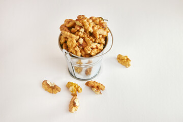 Walnuts in a metal mini-bucket.