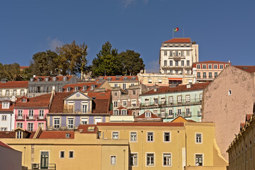 Pastel colored houses and apartment buildings on a hill of Lisbon