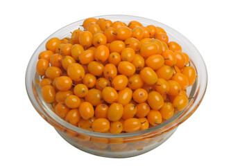 Sea buckthorn berries in a plate, isolated on a white background