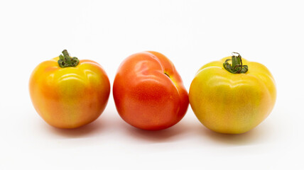 fresh organic tomatoes isolated on white background.