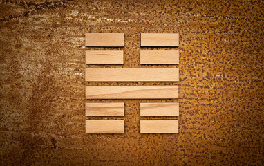 wooden Gene Key 62 i ging hexagram on rusty metal background human design