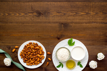 Sweet almond oil and milk with nuts seeds. Healthy food and cosmetic background