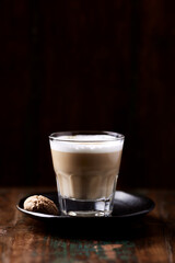 Coffee with milk on dark wooden background. Soft focus. Copy space.	                                                            