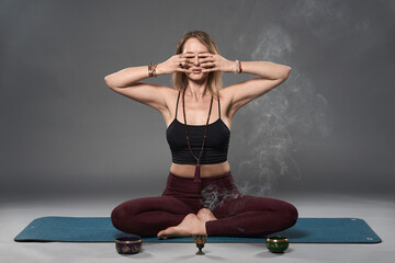 Young woman yoga trainer