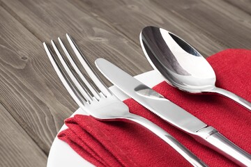 Elegance empty plate, napkin, cutlery set on the desk