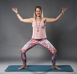 Young woman yoga trainer