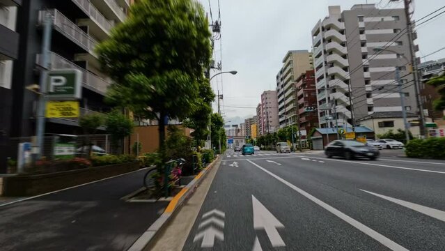 4k Time lapse of cars and trucks driving on a big road in the city of Tokyo, Japan.