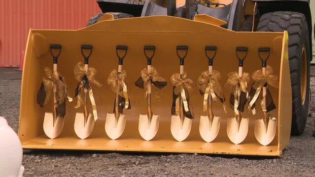 GOLDEN SHOVELS AT A BREAKING GROUND CEREMONY