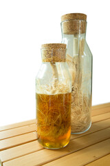 Honey-picked dried hemp root in a glass jar.
