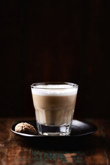 Coffee with milk on dark wooden background. Soft focus. Copy space.