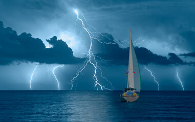 Sailing yacht in a stormy weather with thunder and lightning - obrazy, fototapety, plakaty