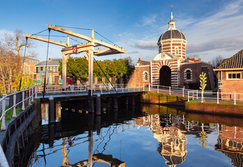 The old city gate Morspoort in Leiden at sunrise.