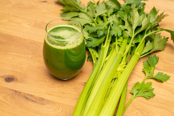organic celery juice on wood background