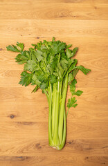 Celery on wood background healthy food