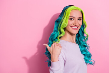 Photo of young pretty good mood girl with gradient teal hair promote recommend product isolated on pink color background