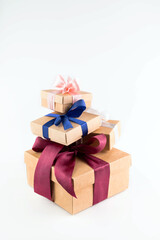 Gift boxes are stacked on a white background.Festive background.