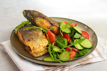 Salad and fried fish