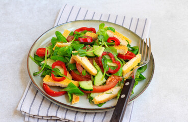 Fried chicken fillet and fresh vegetables salad