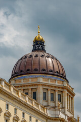 Fototapeta premium Famous central Unter den Linden street, Berlin Royal Palace dome in historical and business downtown of Berlin, Germany, at dramatic rainy sky.