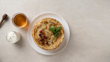 Big pancakes on the table, cooking delicious homemade pancakes